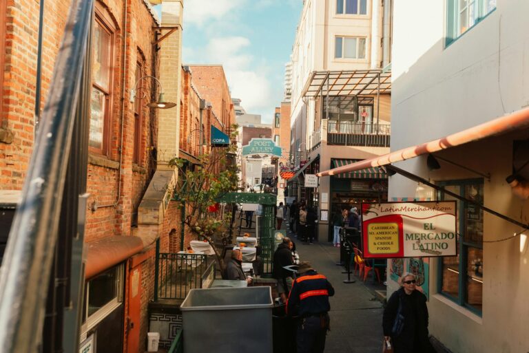 A vibrant view of Post Alley in Seattle, showcasing Latin American shops and lively foot traffic.